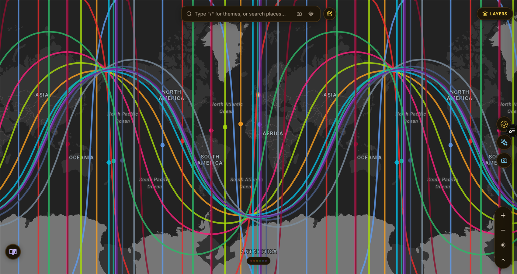 A live ELA Map screenshot showing a full birth chart's astrocartography lines across the globe, each planet drawn as its own colored rising, setting, overhead, and underfoot line